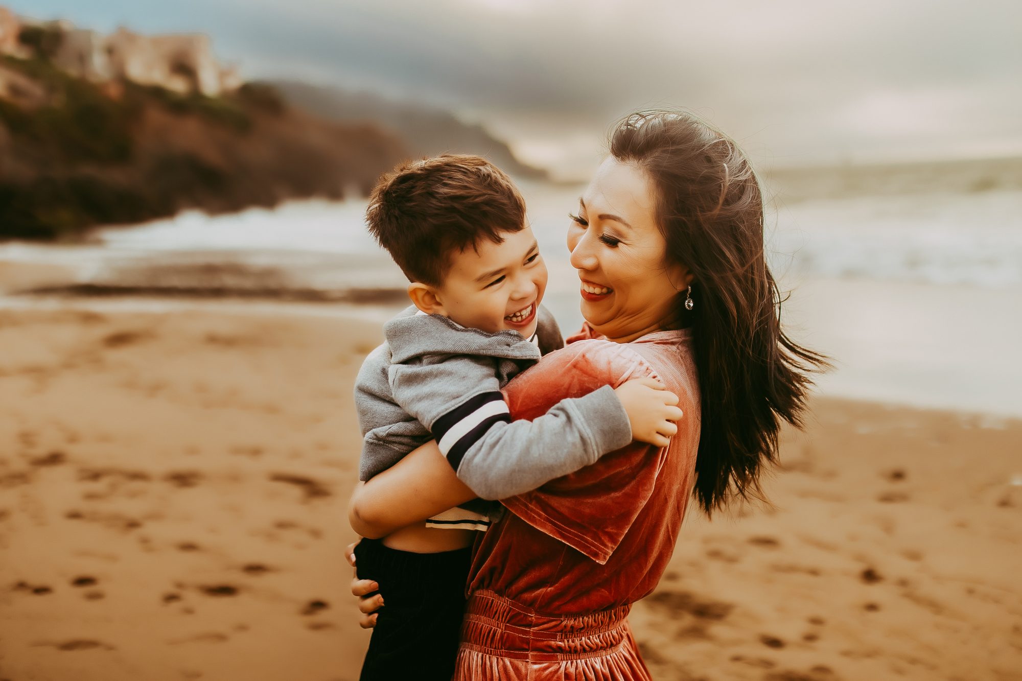 Shefali Parekh | Capturing Joy and Laughter: The Family Session at Baker Beach A happy child & her mother on a beach