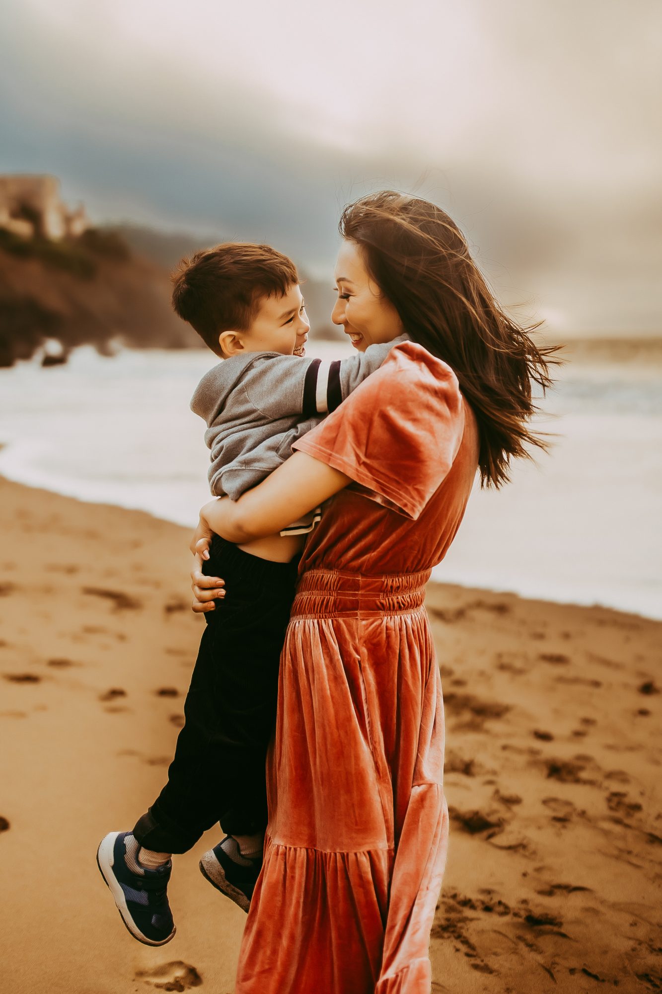 Shefali Parekh | Capturing Joy and Laughter: The Family Session at Baker Beach A mother cherishing her son