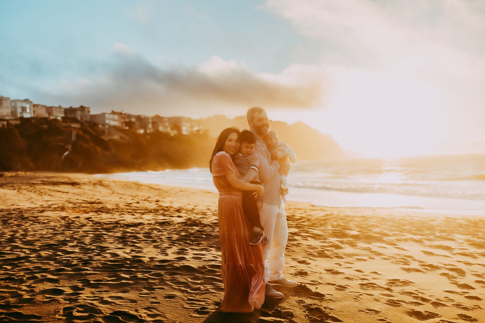Shefali Parekh | Capturing Joy and Laughter: The Family Session at Baker Beach A Family on the beach with a beautiful sunset