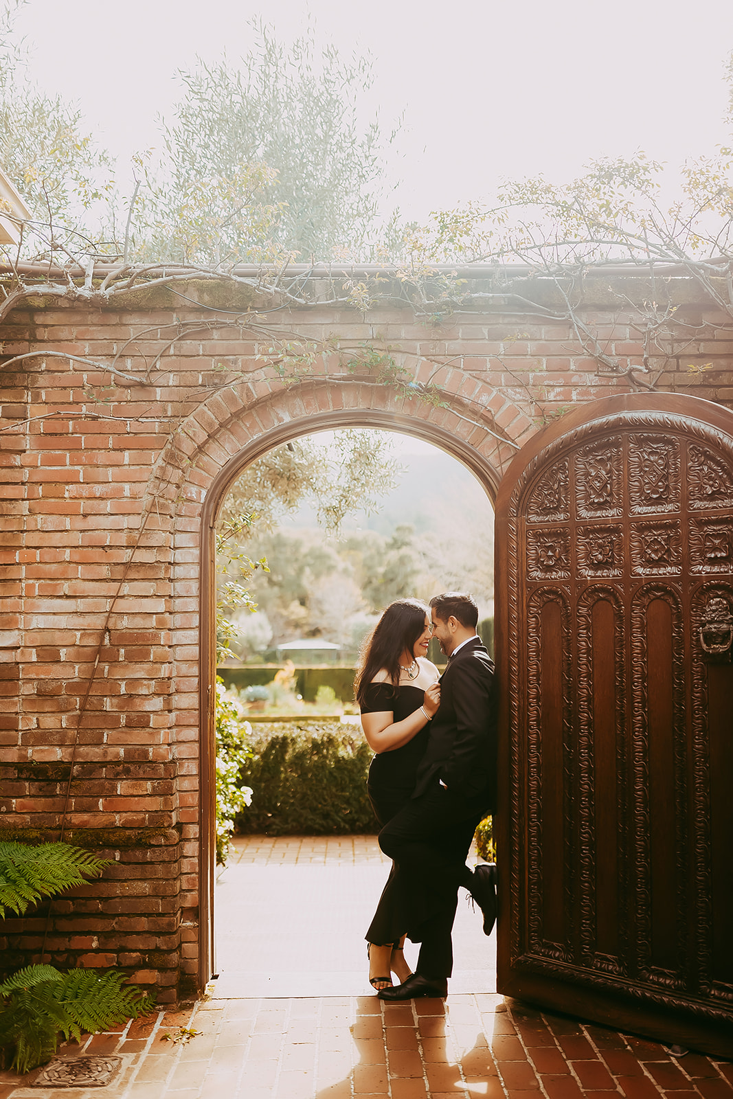 Shefali Parekh | Menlo Park Family Photographer: 10th Anniversary Session at Filoli Historic Garden Anniversary couple standing in iconic doorway at Filoli Historic House captured by Menlo Park family photographer