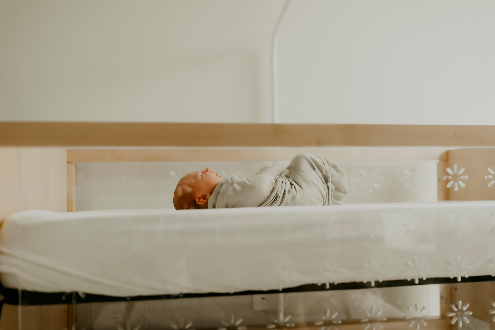 Shefali Parekh | Heartwarming In-Home Newborn Session: Maggie & Alex Black in Cow Hollow, San Francisco Newborn lying on the bed