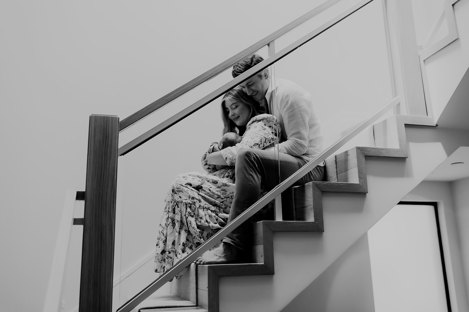 Shefali Parekh | Heartwarming In-Home Newborn Session: Maggie & Alex Black in Cow Hollow, San Francisco Family sitting on the stairs