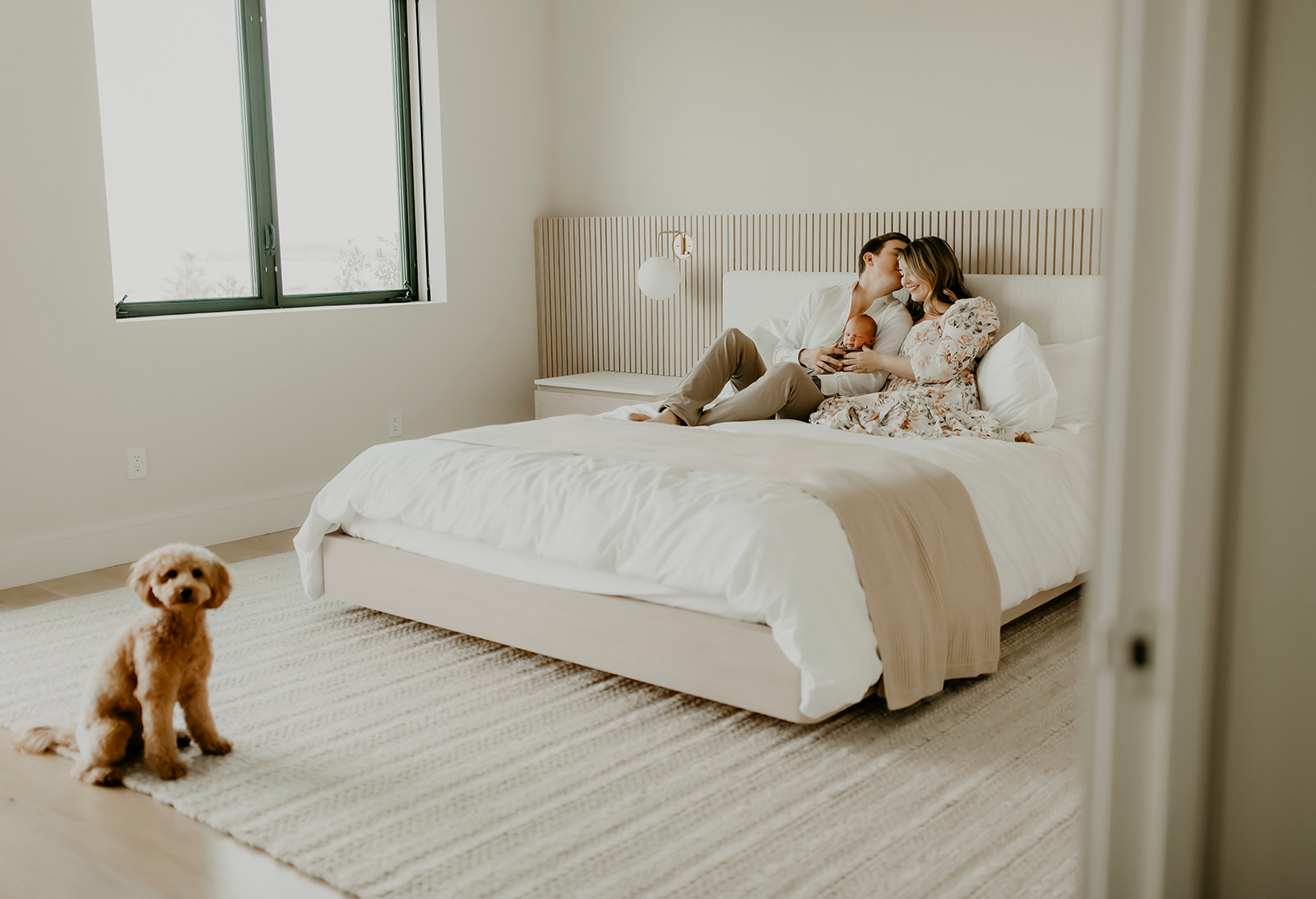 Shefali Parekh | Heartwarming In-Home Newborn Session: Maggie & Alex Black in Cow Hollow, San Francisco Couple in the bedroom with their newborn baby