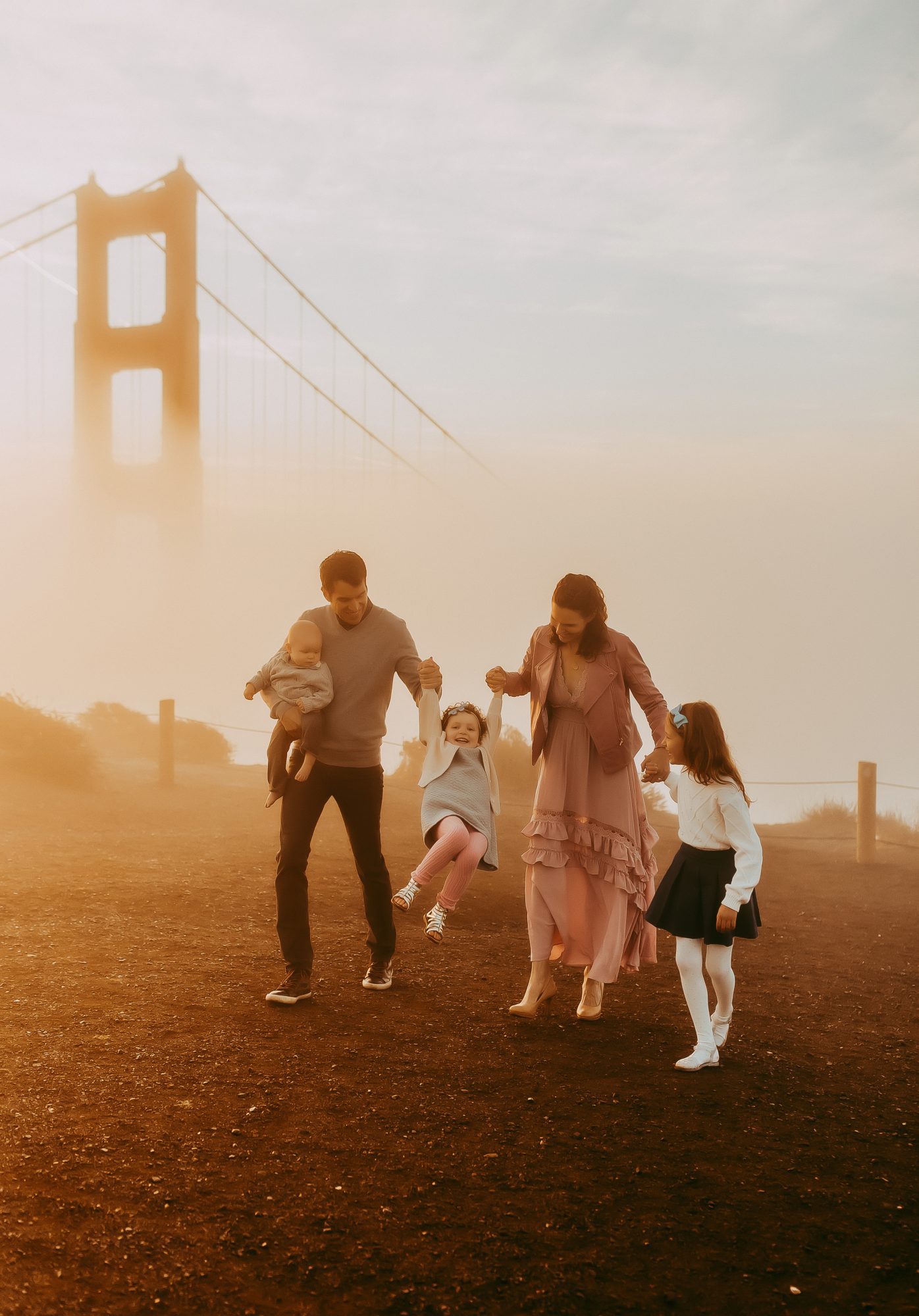 Shefali Parekh | Sunrise Family Photography in Marin County: Capturing Magic in the Morning Family of five spending happy moments with golden gate bridge at the back at Battery Spencer Overlook