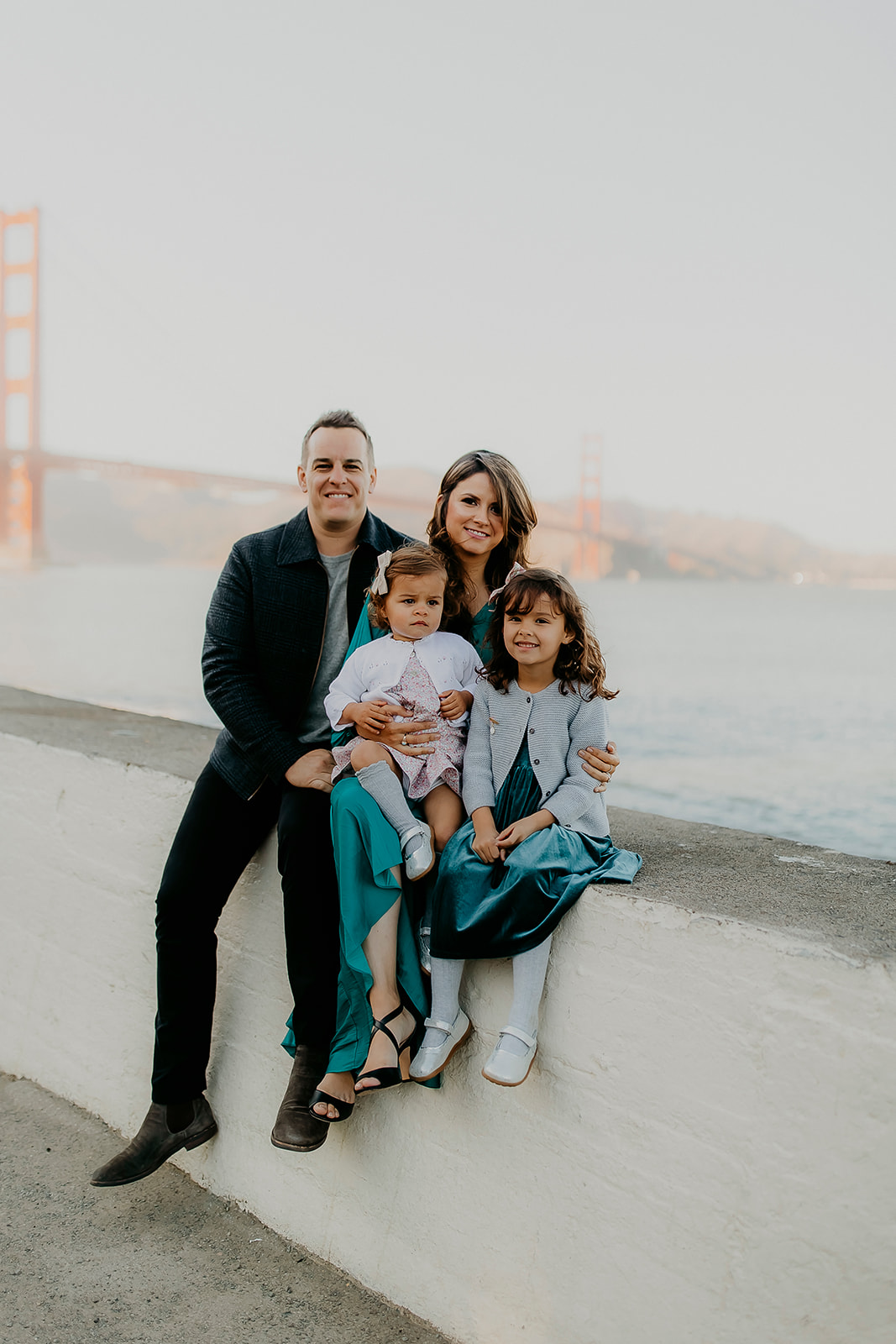 Shefali Parekh | The Best Location for Family Photography: Crissy Field Family of four posing during the sunset time at Crissy Field