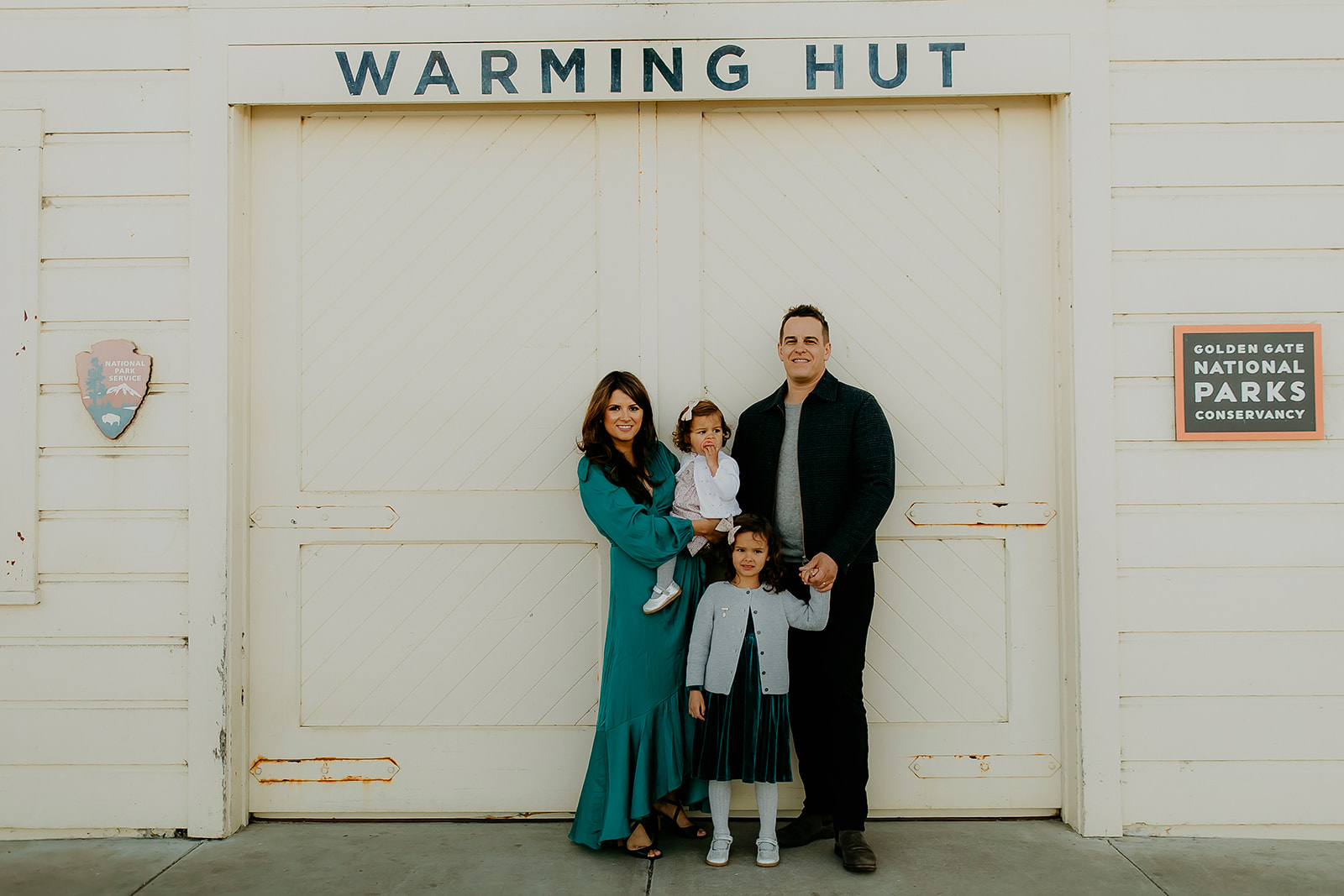 Shefali Parekh | The Best Location for Family Photography: Crissy Field Family posing by Crissy Field, San Francisco