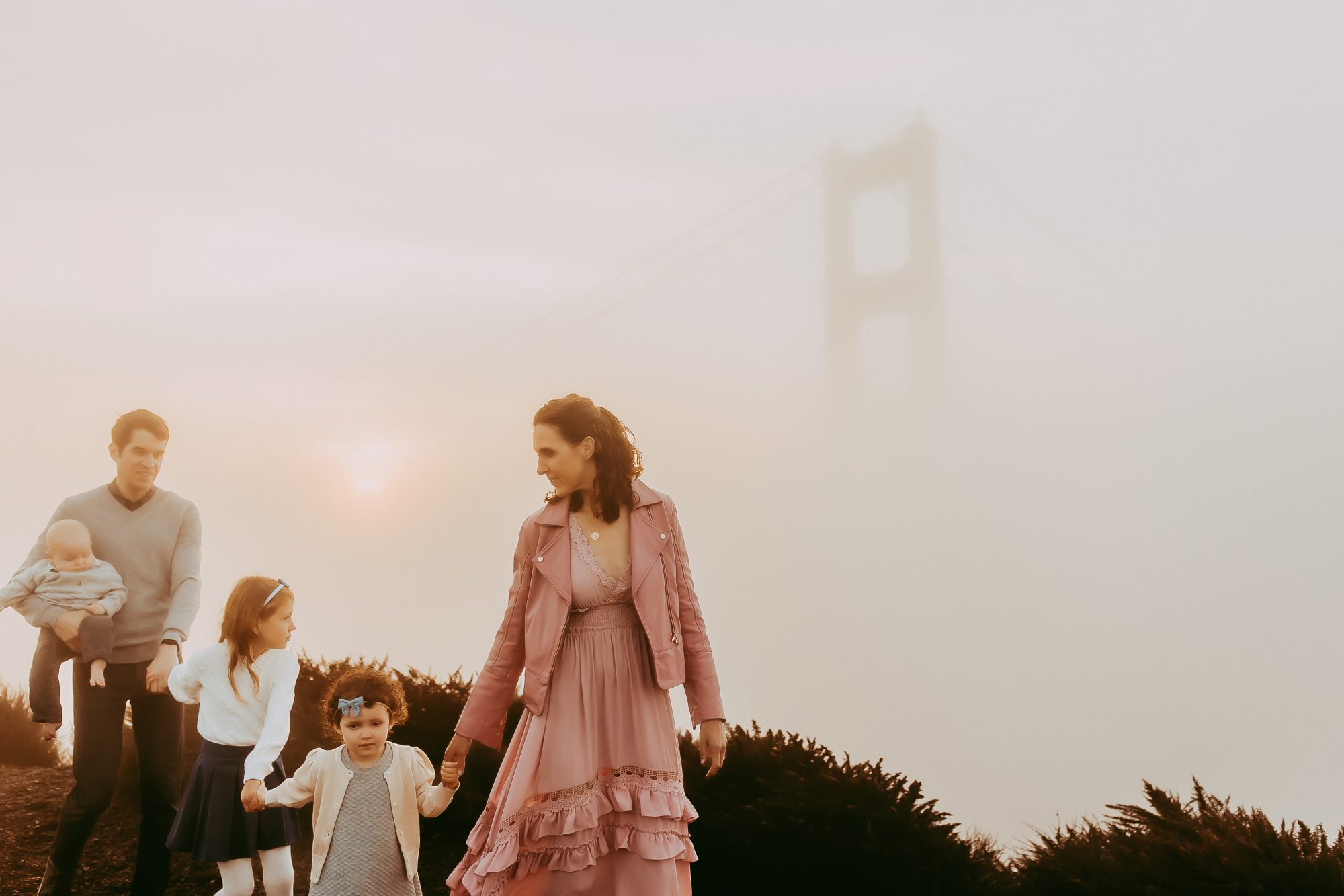 Shefali Parekh | Sunrise Family Photography in Marin County: Capturing Magic in the Morning Family walking with foggy morning in the background
