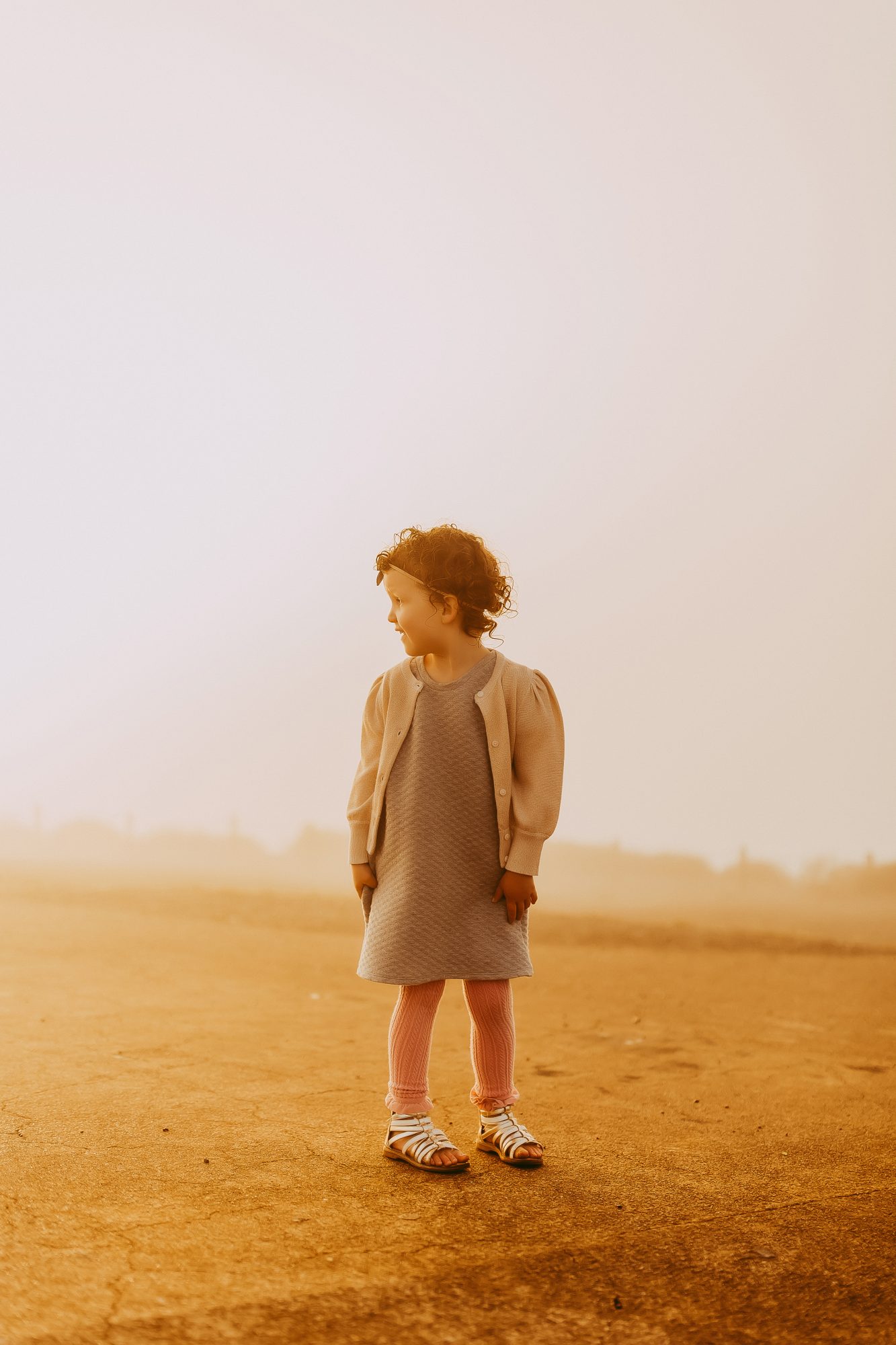 Shefali Parekh | Sunrise Family Photography in Marin County: Capturing Magic in the Morning Kid posing for a picture