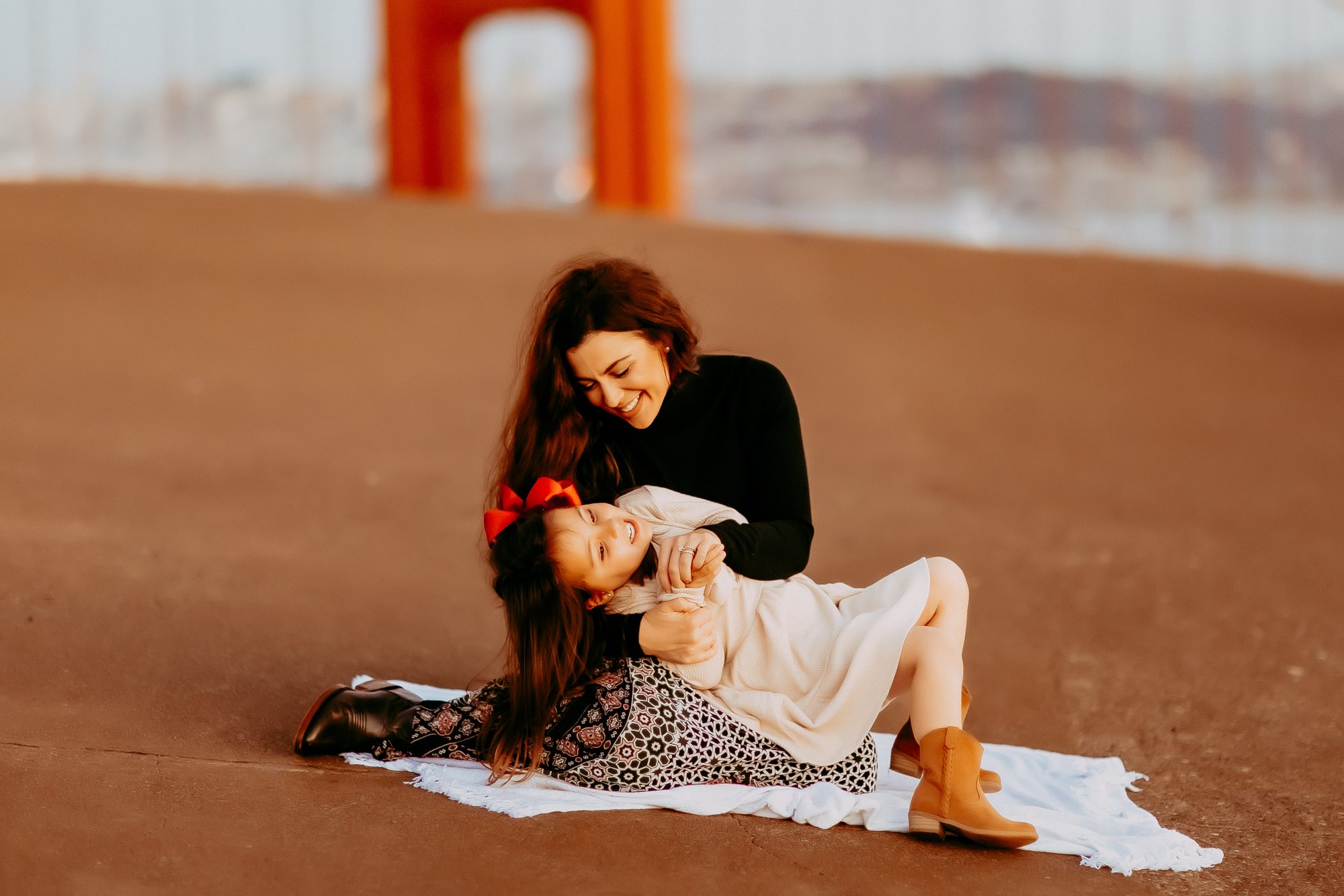 Shefali Parekh | Marin County Family Photographer: Battery Spencer Family Photos Mother sitting with her daughter playing in her lap
