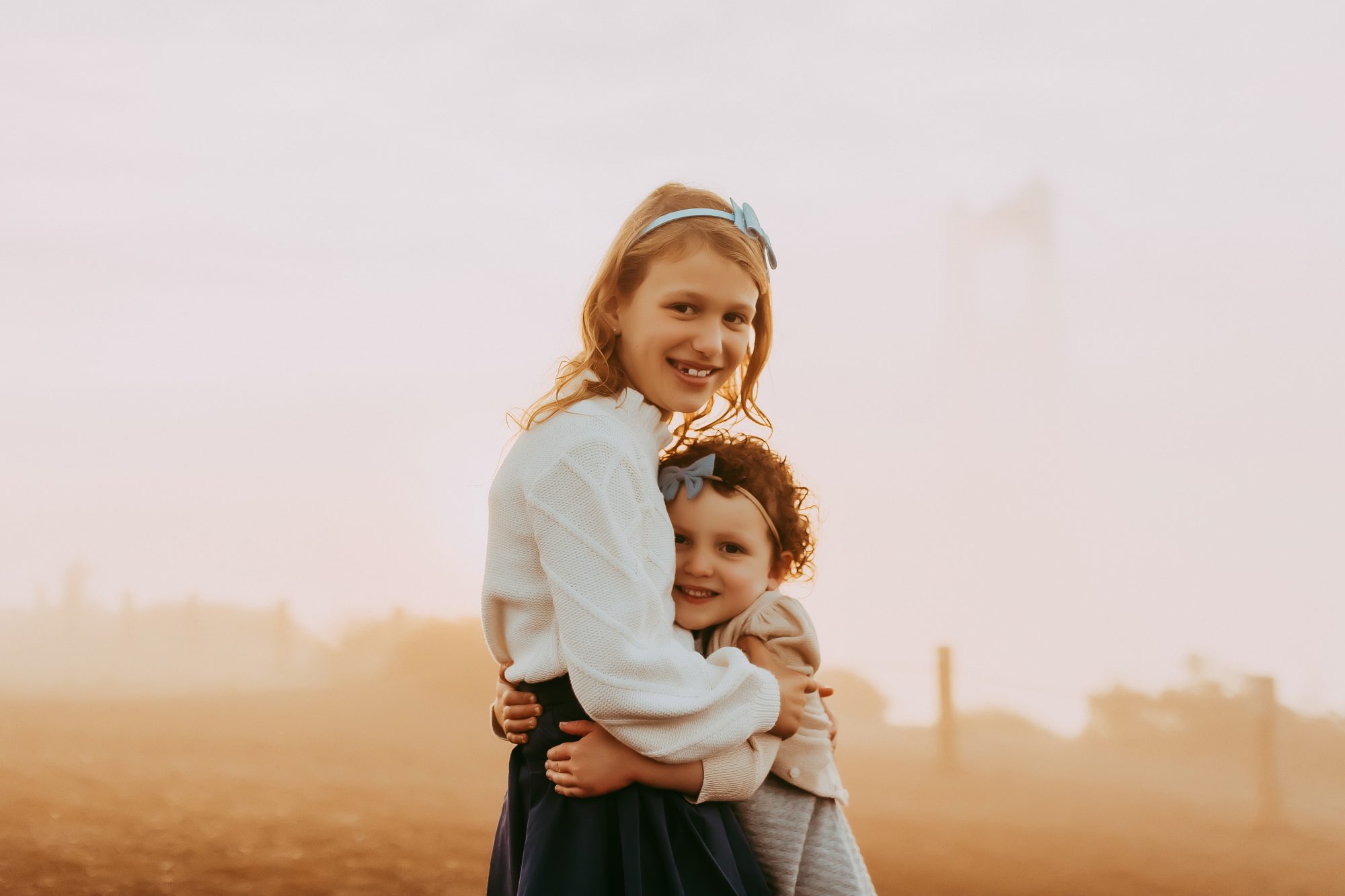 Shefali Parekh | Sunrise Family Photography in Marin County: Capturing Magic in the Morning Two sisters posing together
