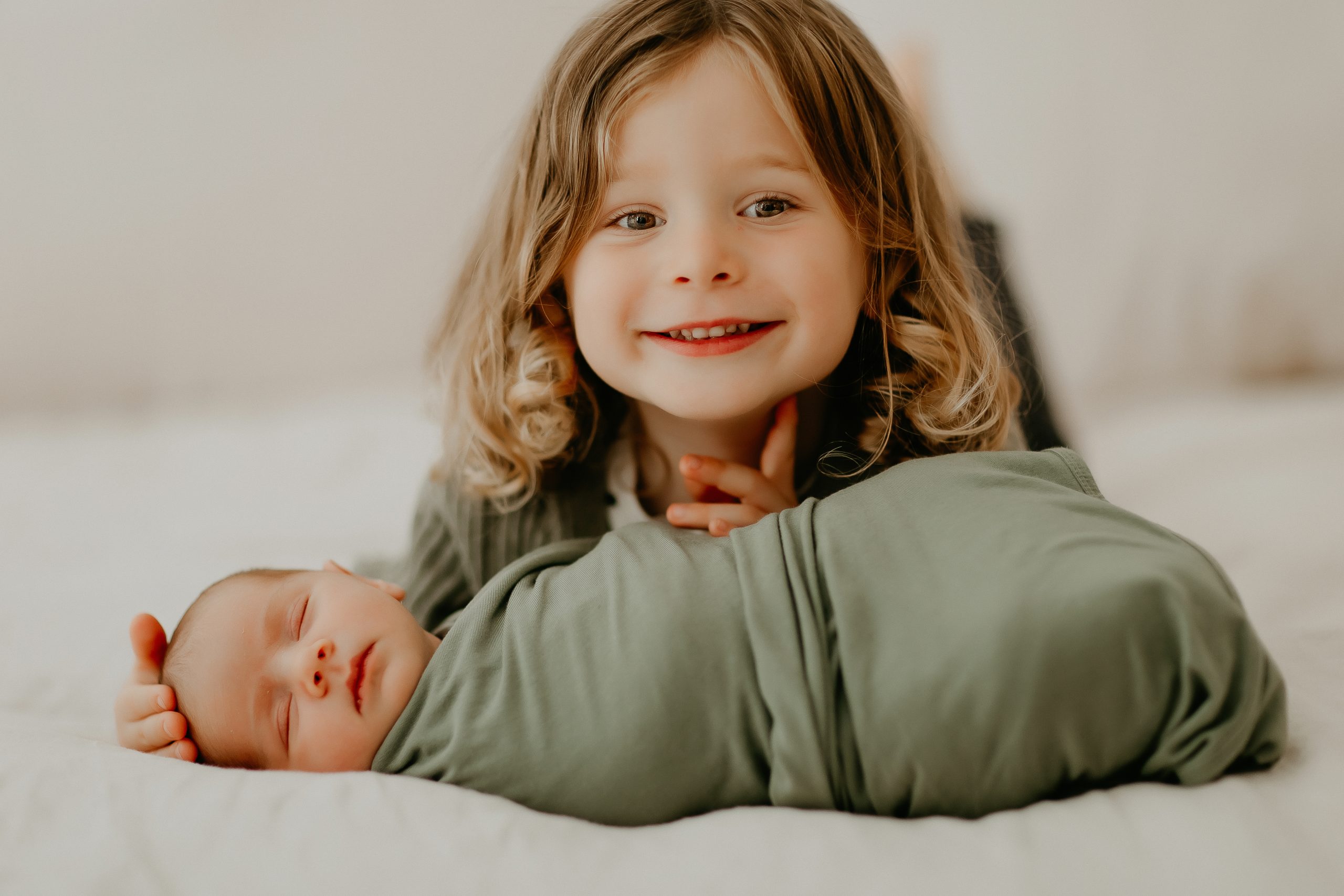 Shefali Parekh | Getting Ready for Your Lifestyle Newborn Photography Session: Tips for New Parents Older sibling cuddling with newborn baby in San Francisco lifestyle newborn photography