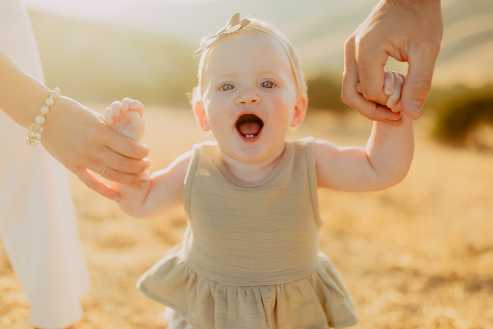Shefali Parekh | Creating Your Family's Visual Story | Bay Area Photographer Tips Capturing a baby enjoying the golden hour light in a scenic field overlooking hills