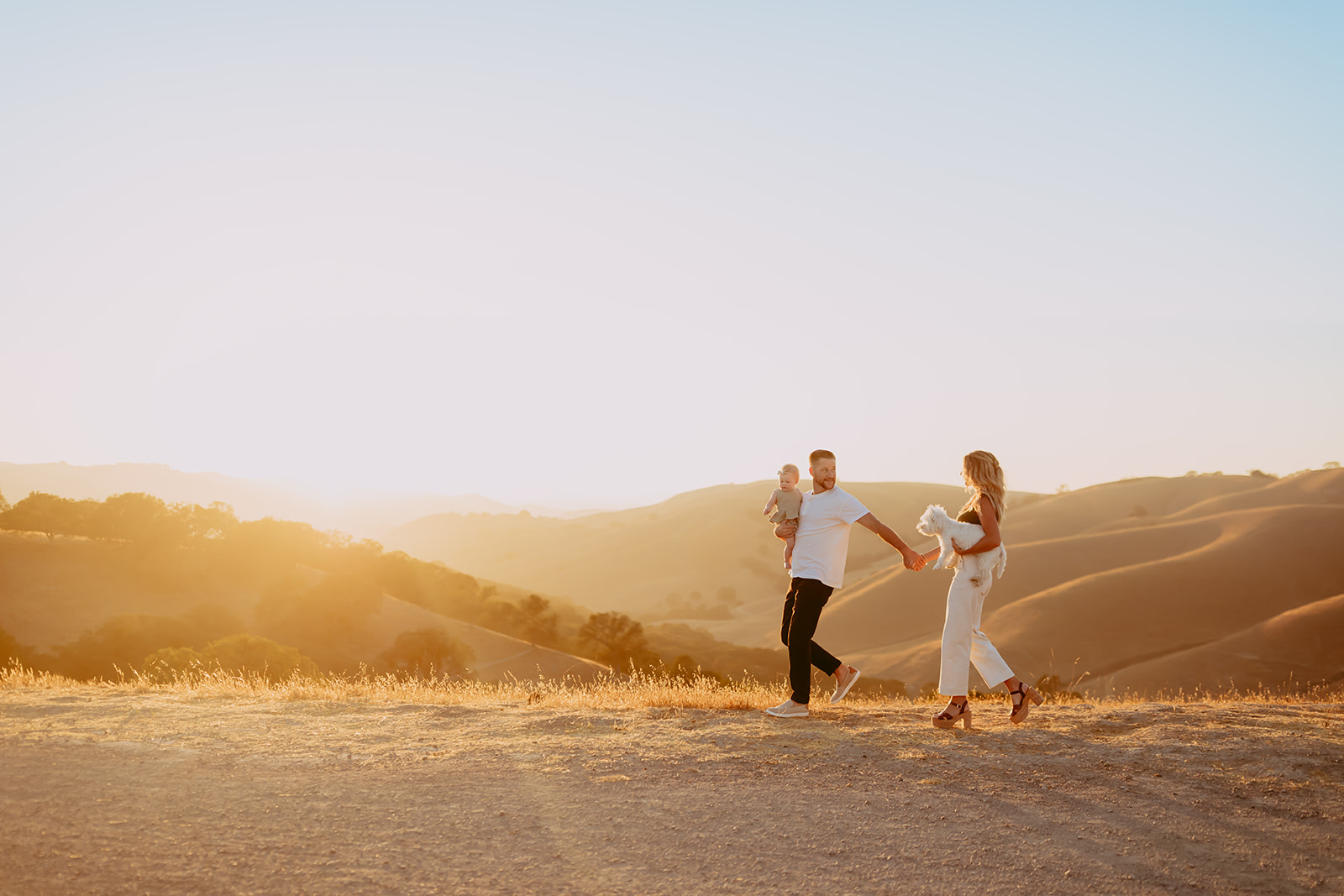 Shefali Parekh | Creating Your Family's Visual Story | Bay Area Photographer Tips Family portrait by a Bay Area photographer in a beautiful field with hills and sunset glow