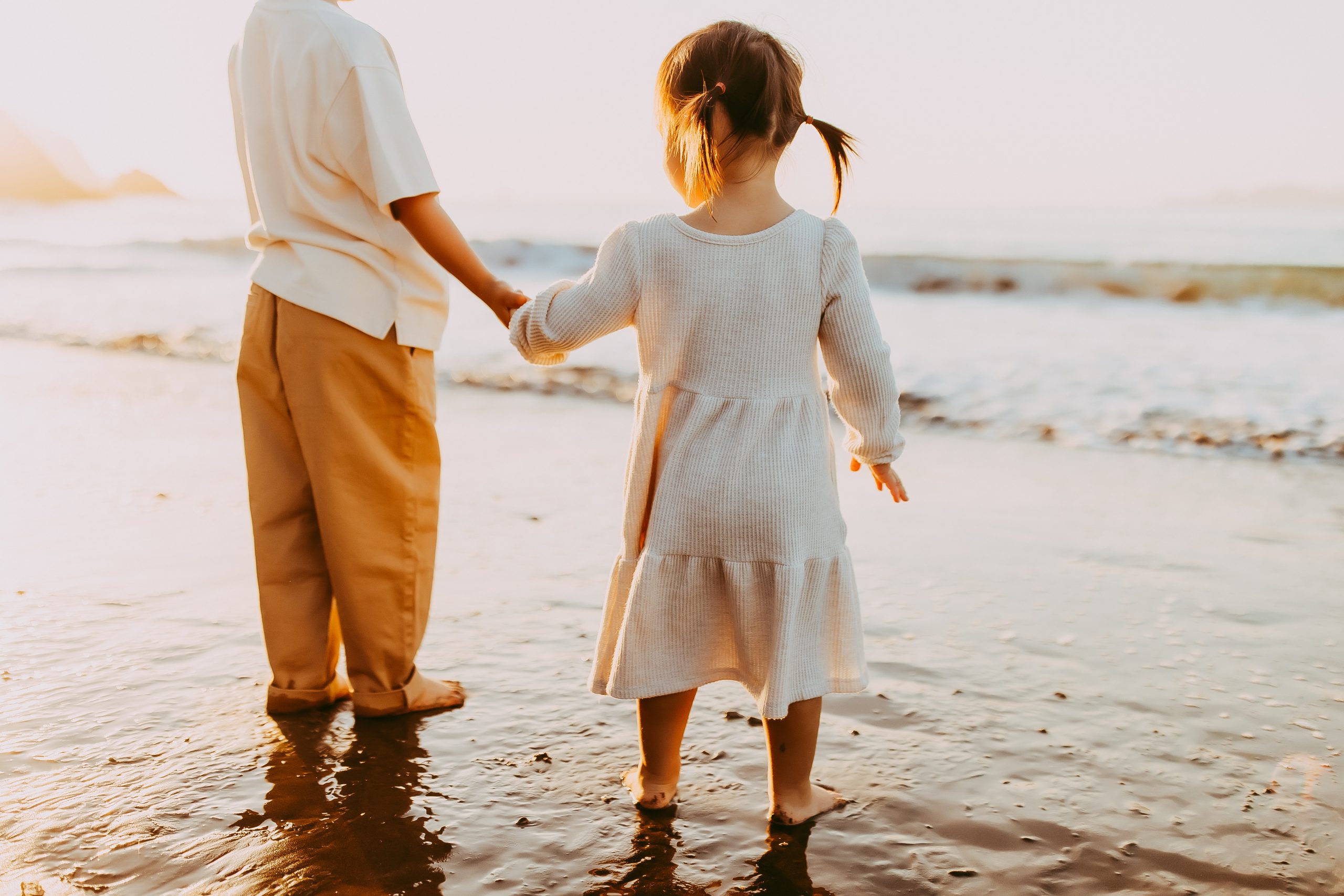 Shefali Parekh | Bay Area Beach Family Photoshoot Tips Toddler playing in the sand during a Bay Area beach photoshoot