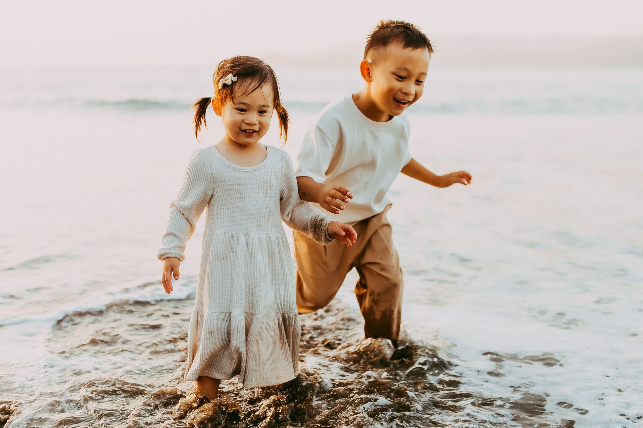 Shefali Parekh | Bay Area Beach Family Photoshoot Tips Siblings running along the shoreline during a fun Bay Area family shoot