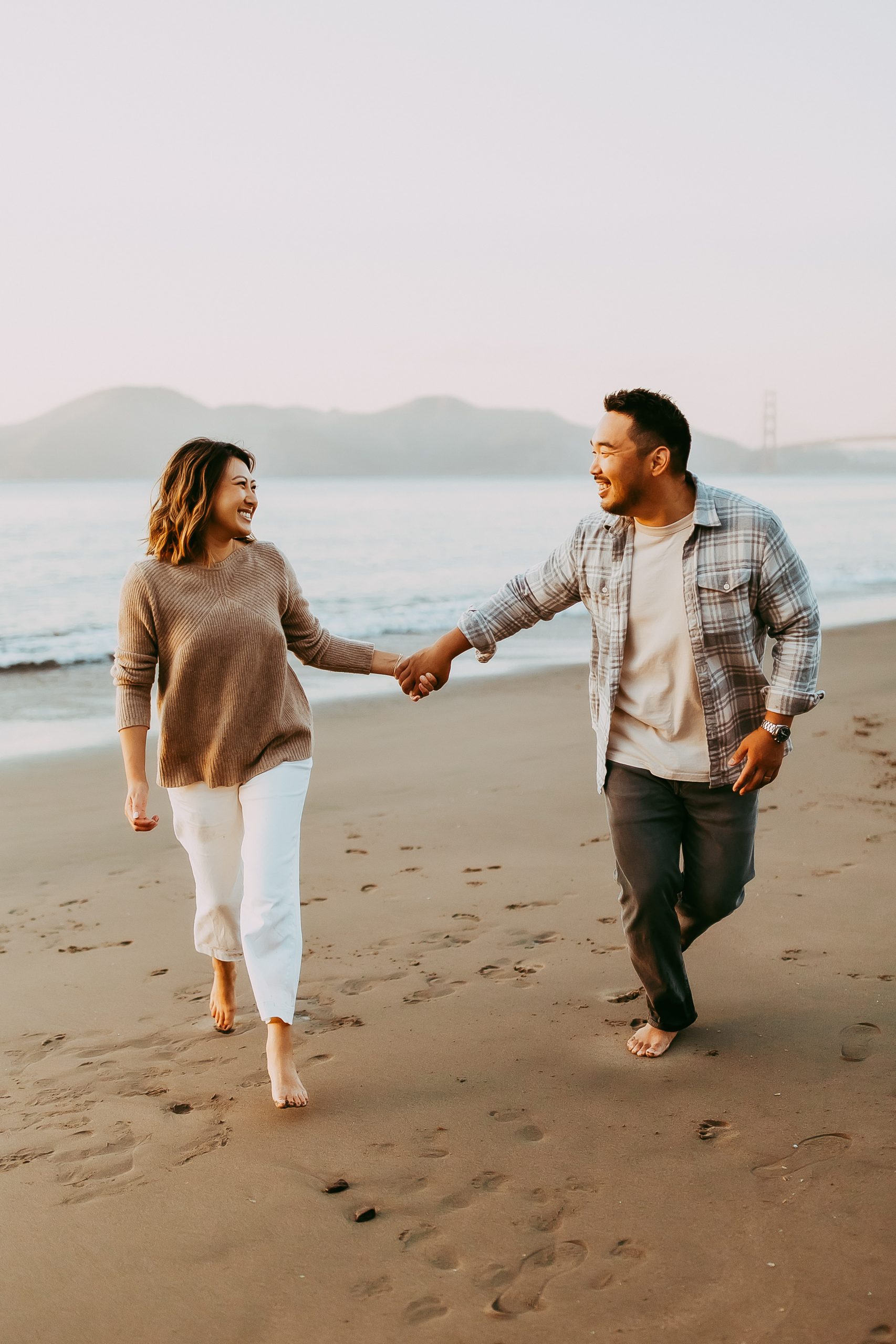 Shefali Parekh | Bay Area Beach Family Photoshoot Tips Happy couple enjoying their family beach session in the Bay Area.