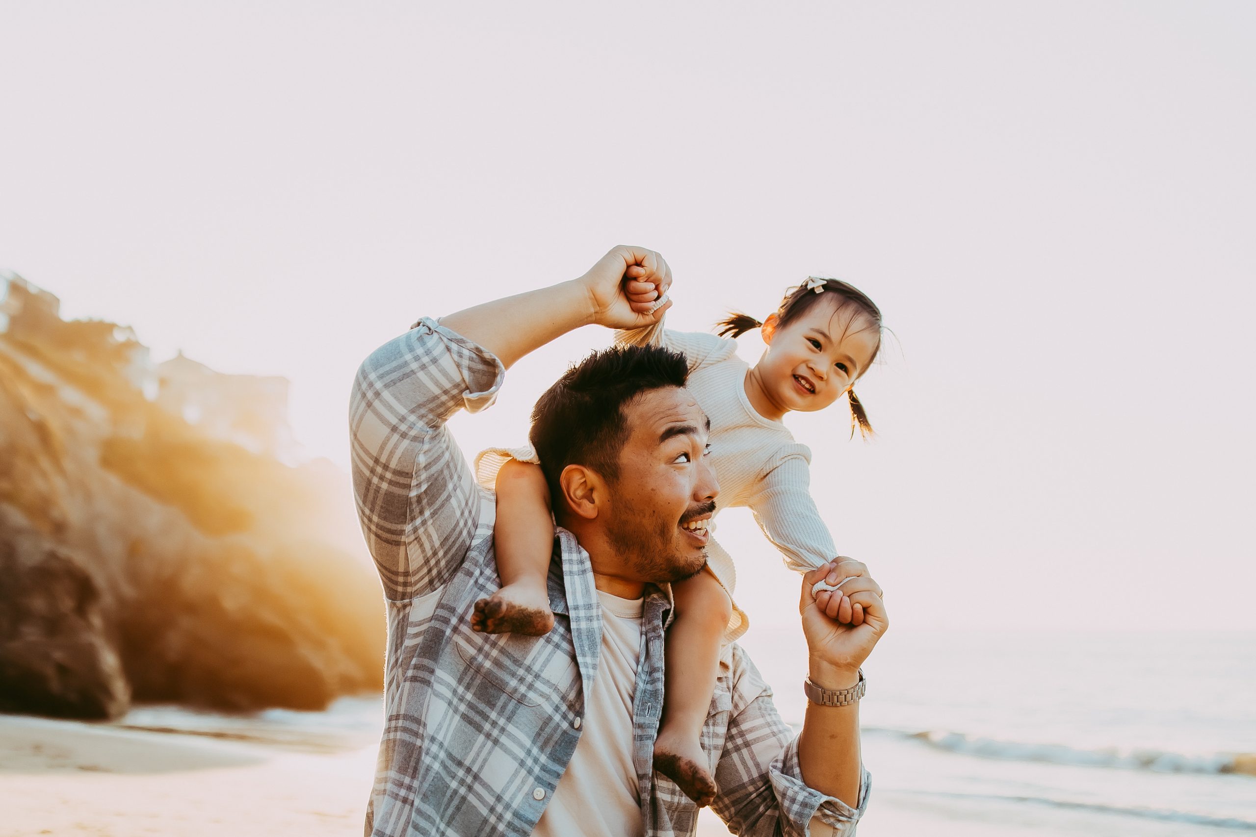 Shefali Parekh | Bay Area Beach Family Photoshoot Tips Father and daughter sharing a laugh during a Bay Area beach session