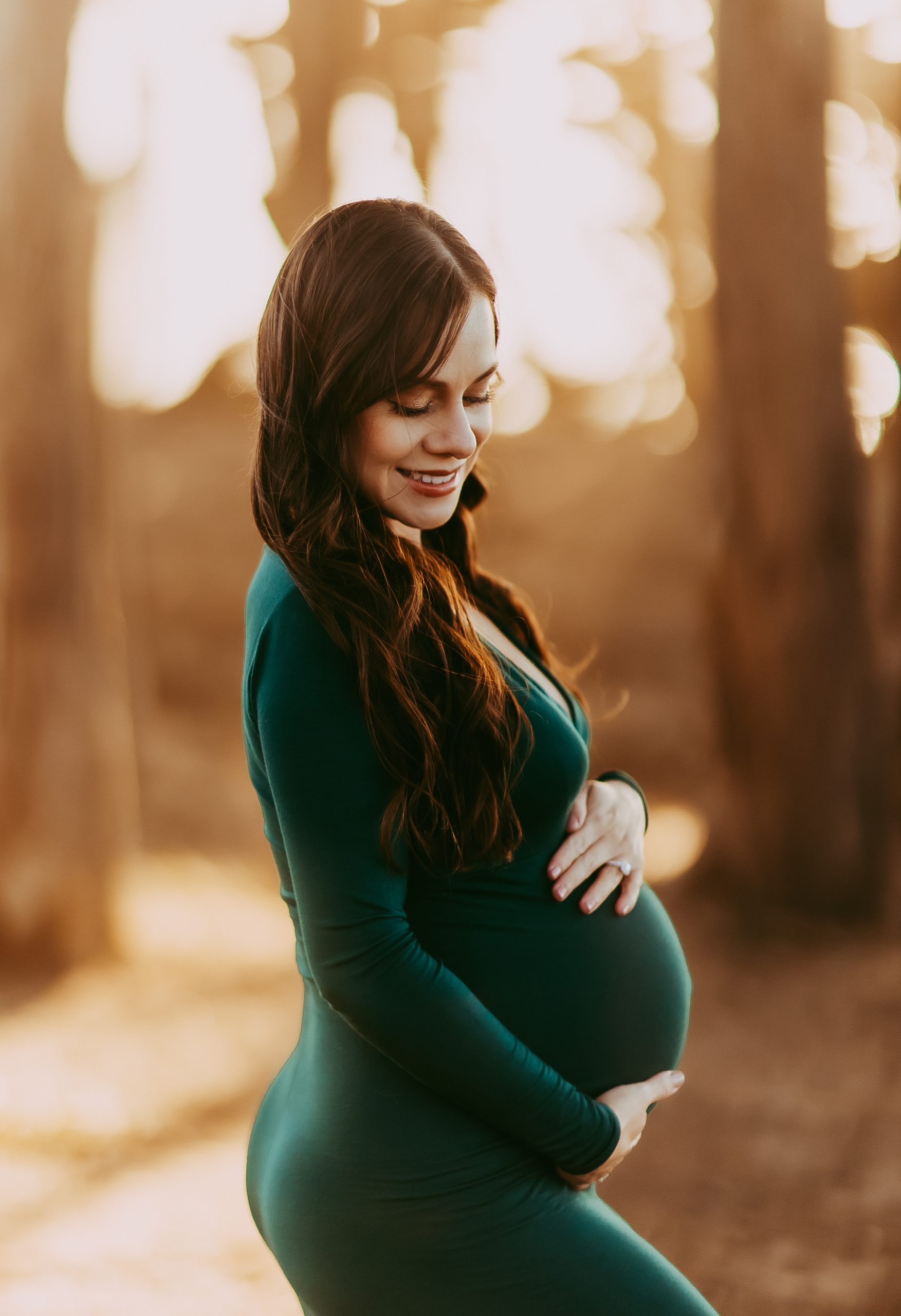 Mom to be holding baby bump in San Francisco