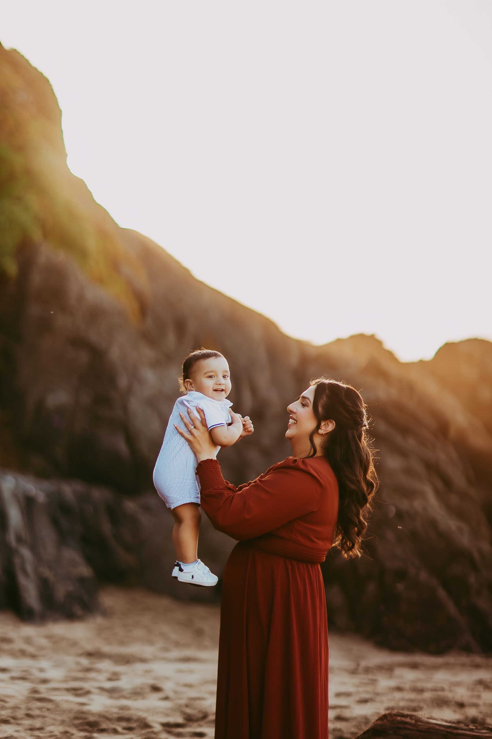 Shefali Parekh | The Best Time for a Baker Beach Photoshoot mom tossing son up in the air