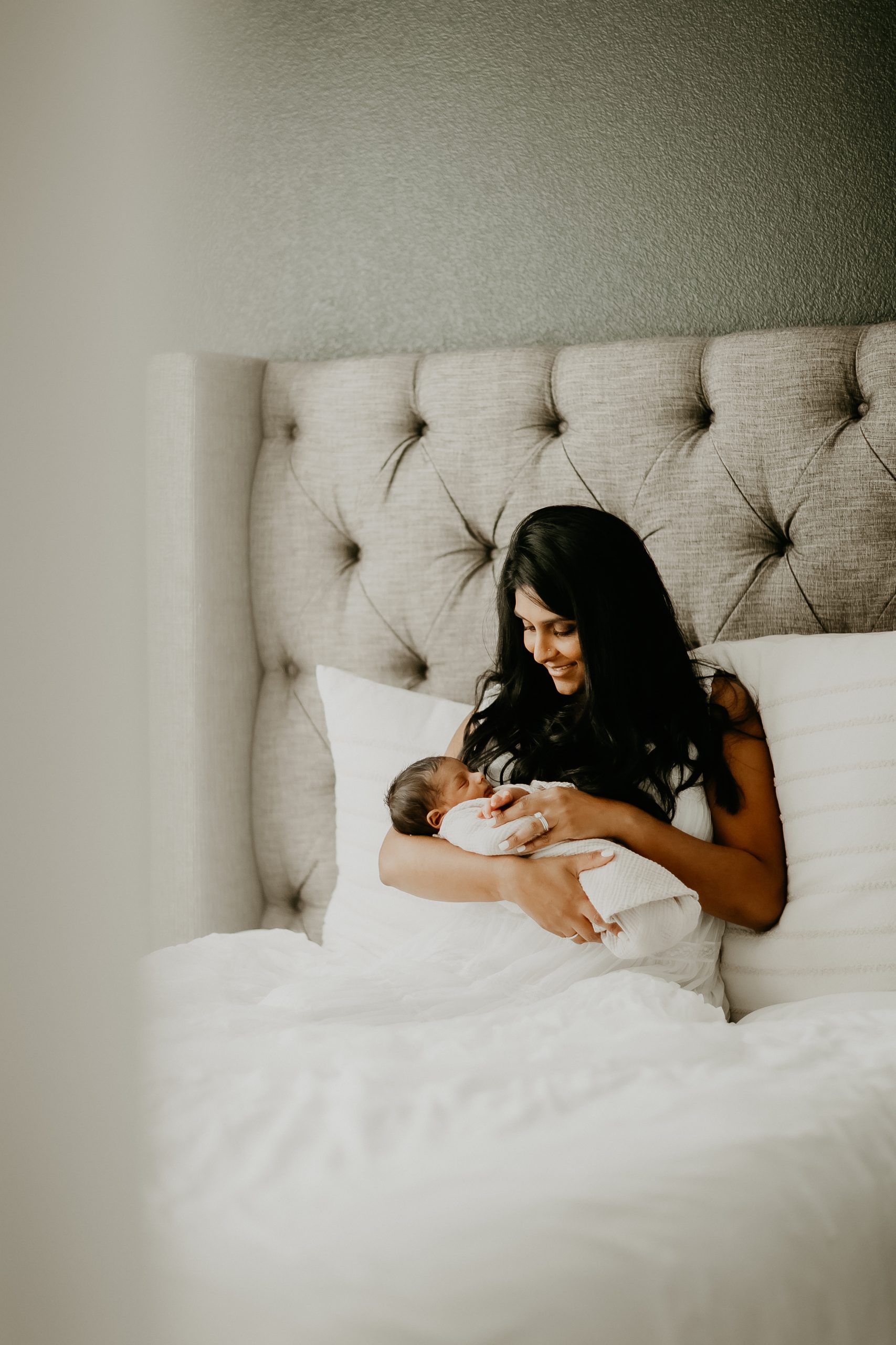 Shefali Parekh | Newborn Photography Trends in San Francisco: What's Popular in 2025 Newborn baby nestled in their mother’s arms during a lifestyle newborn photoshoot in San Francisco
