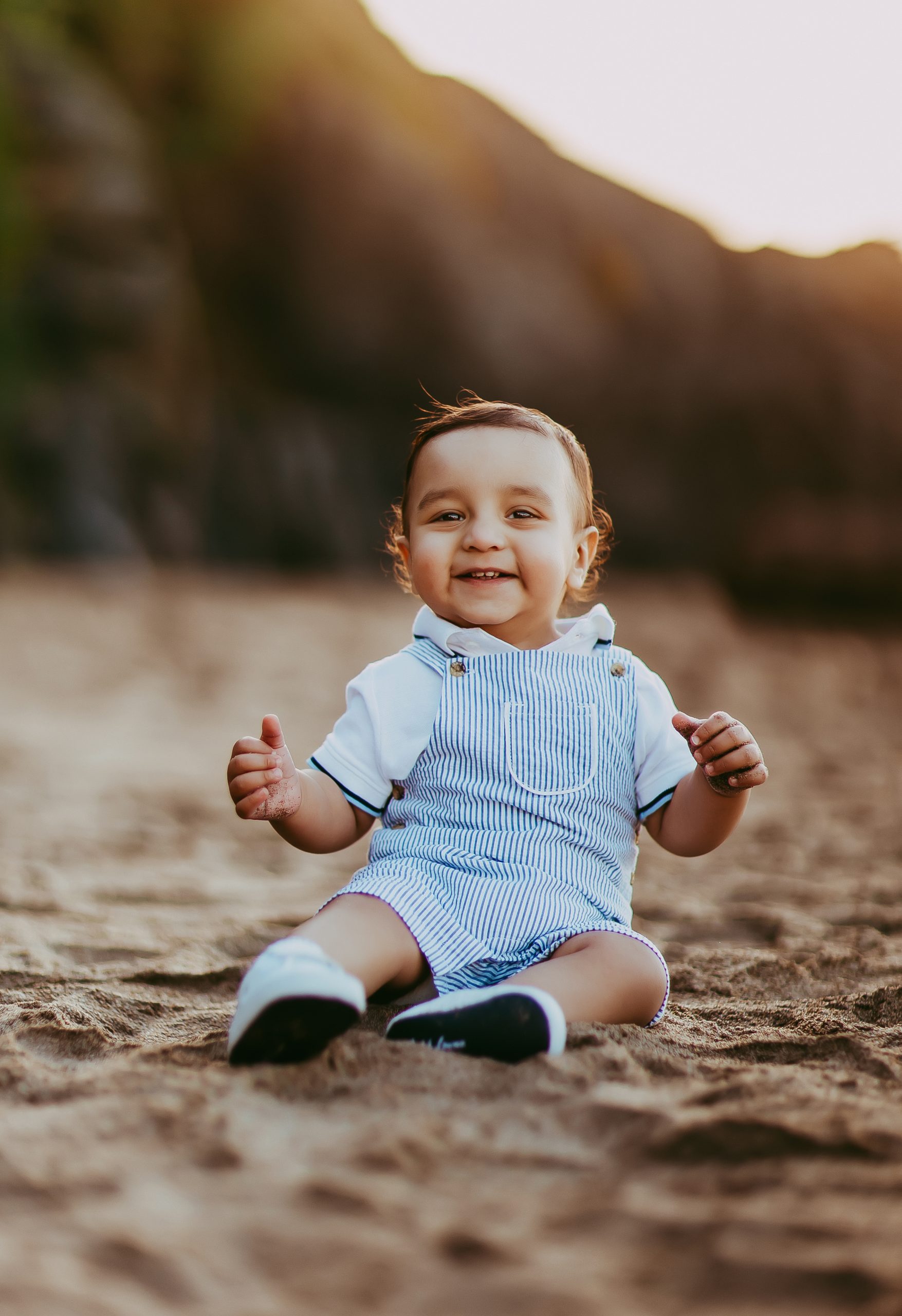 Shefali Parekh | The Best Time for a Baker Beach Photoshoot toddler smiling at the beach in San Francisco