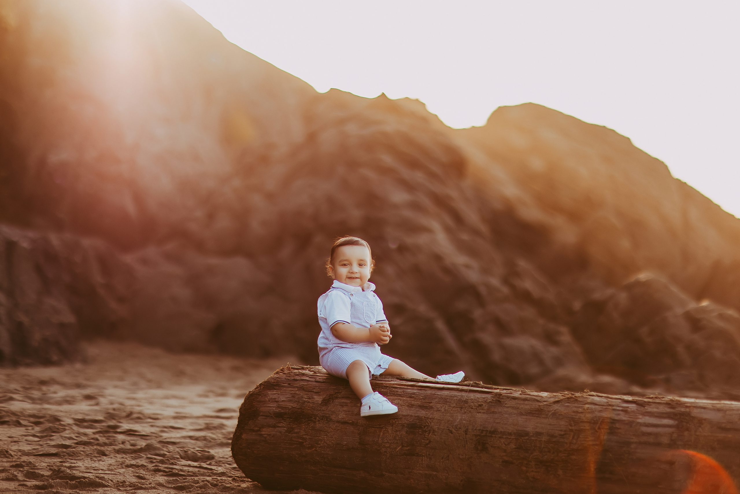 Shefali Parekh | The Best Time for a Baker Beach Photoshoot toddler sitting at beach for first birthday photoshoot