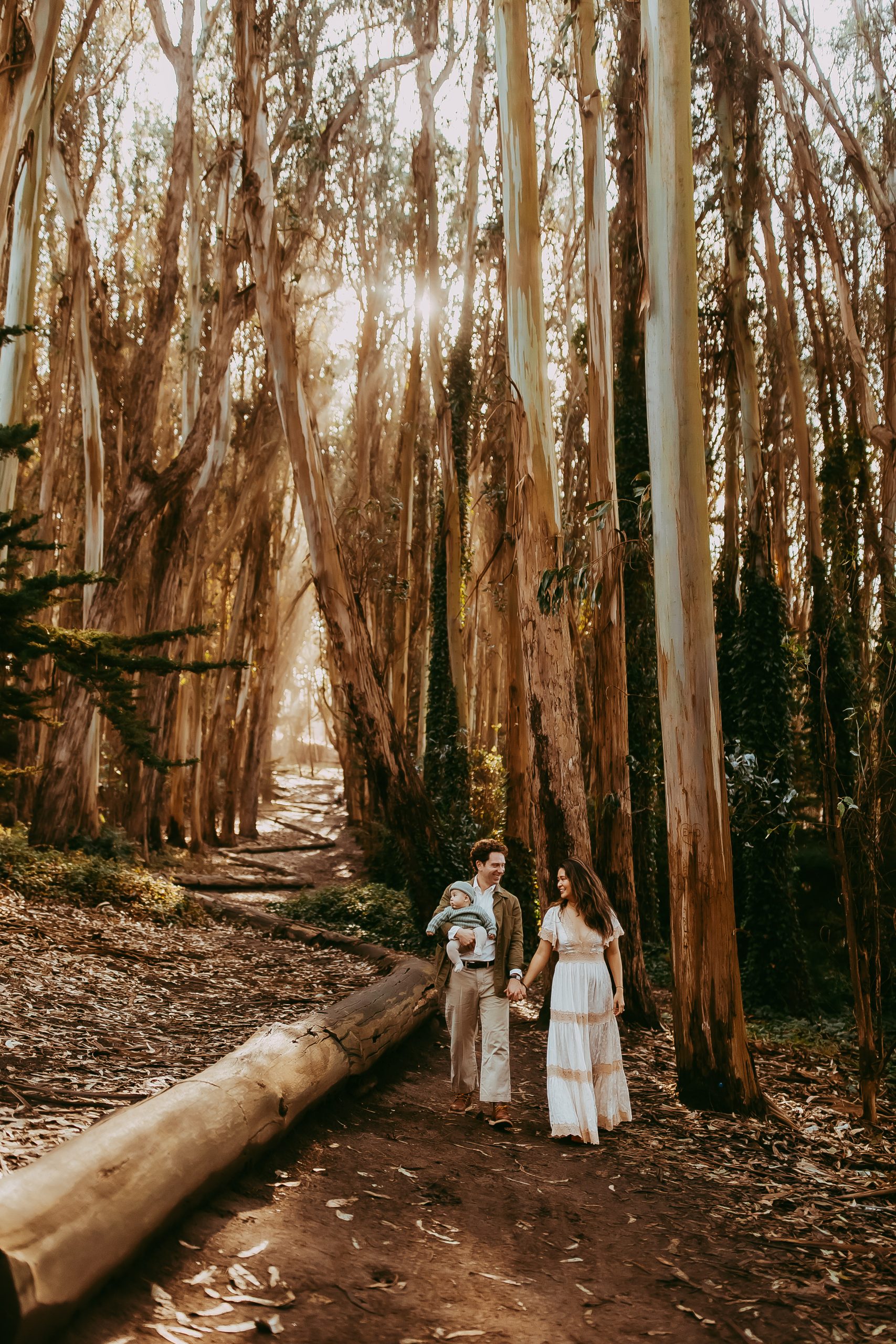 Shefali Parekh | Lovers Lane, San Francisco Family Photography Session Family of three walking through Lovers Lane with their baby boy during a morning photo session