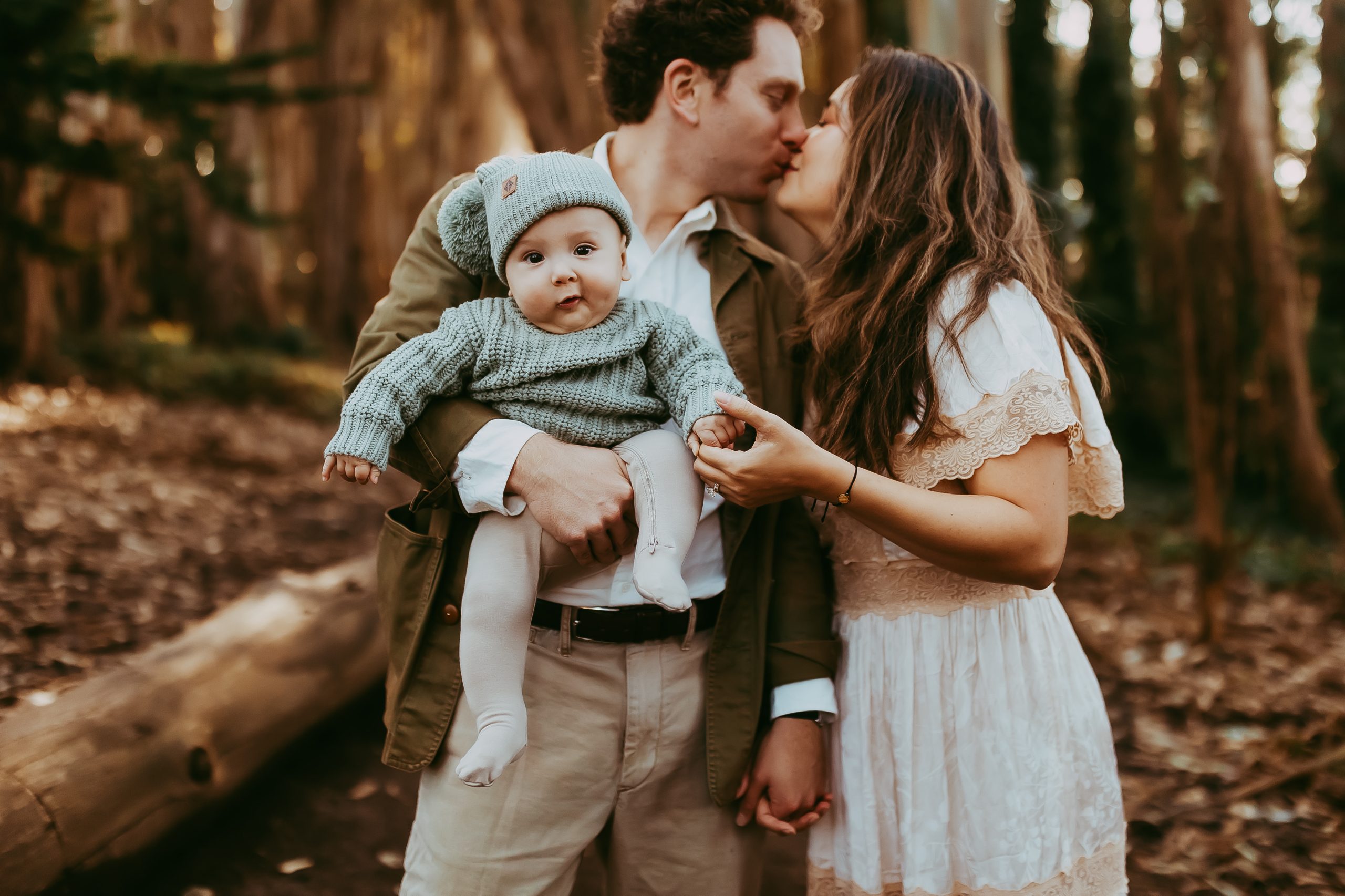 Shefali Parekh | Lovers Lane, San Francisco Family Photography Session Family of three standing under eucalyptus trees at Lovers Lane