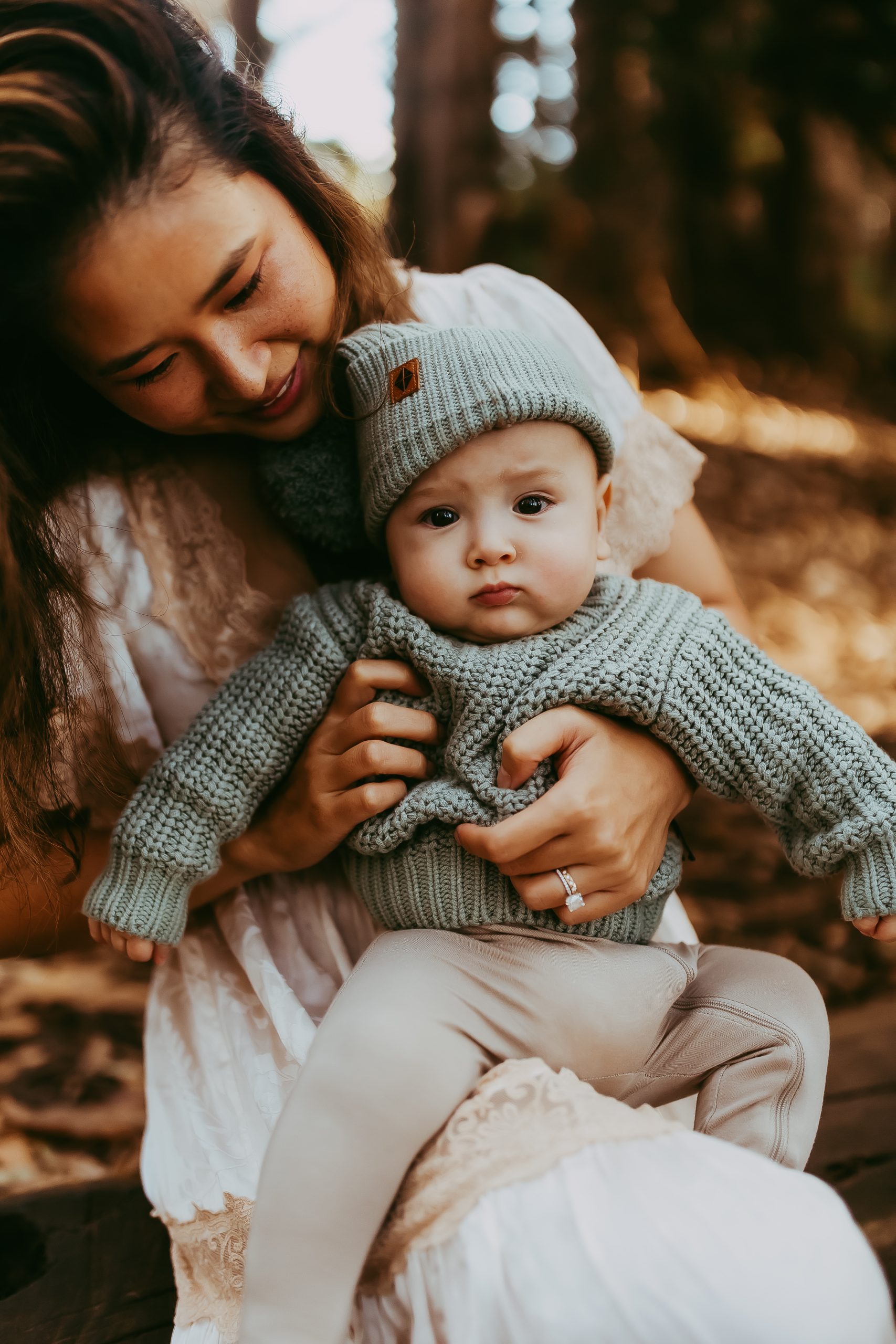 Shefali Parekh | Lovers Lane, San Francisco Family Photography Session Mother cuddling her baby boy in a eucalyptus grove at Lovers Lane