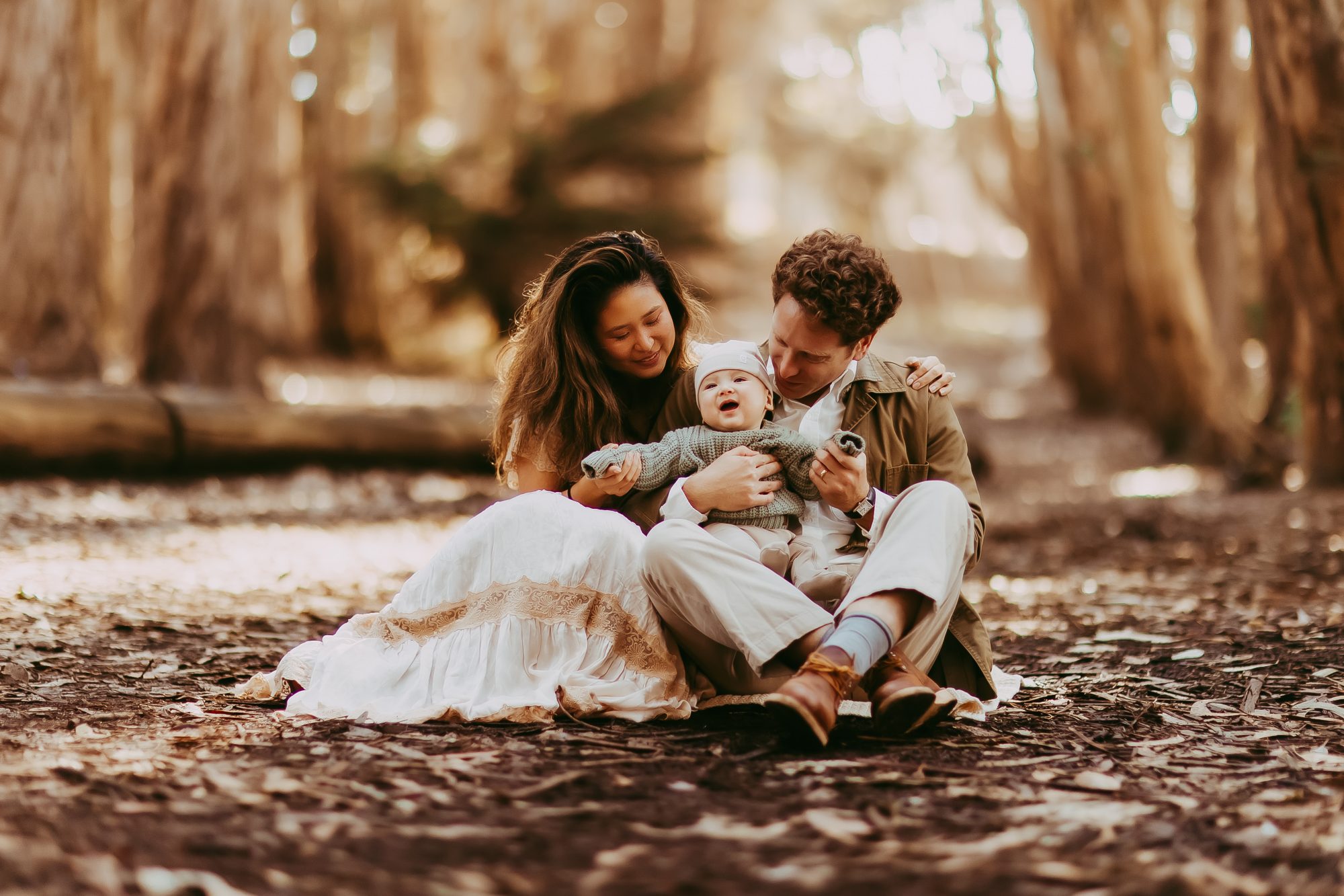 Shefali Parekh | Bay Area Fall Mini Sessions 2025 Outdoor seated portrait of a family of three at Lovers Lane, San Francisco