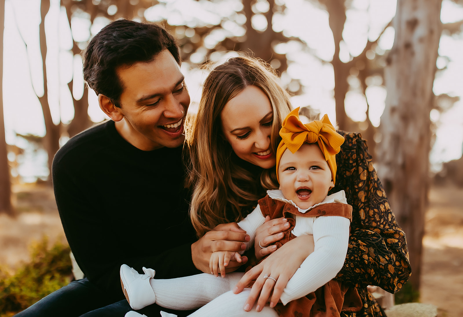Shefali Parekh | Bay Area Fall Mini Sessions 2025 san francisco parents snuggling with daughter